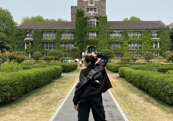 Aanandi posing in front of Yonsei University in Seoul, Korea